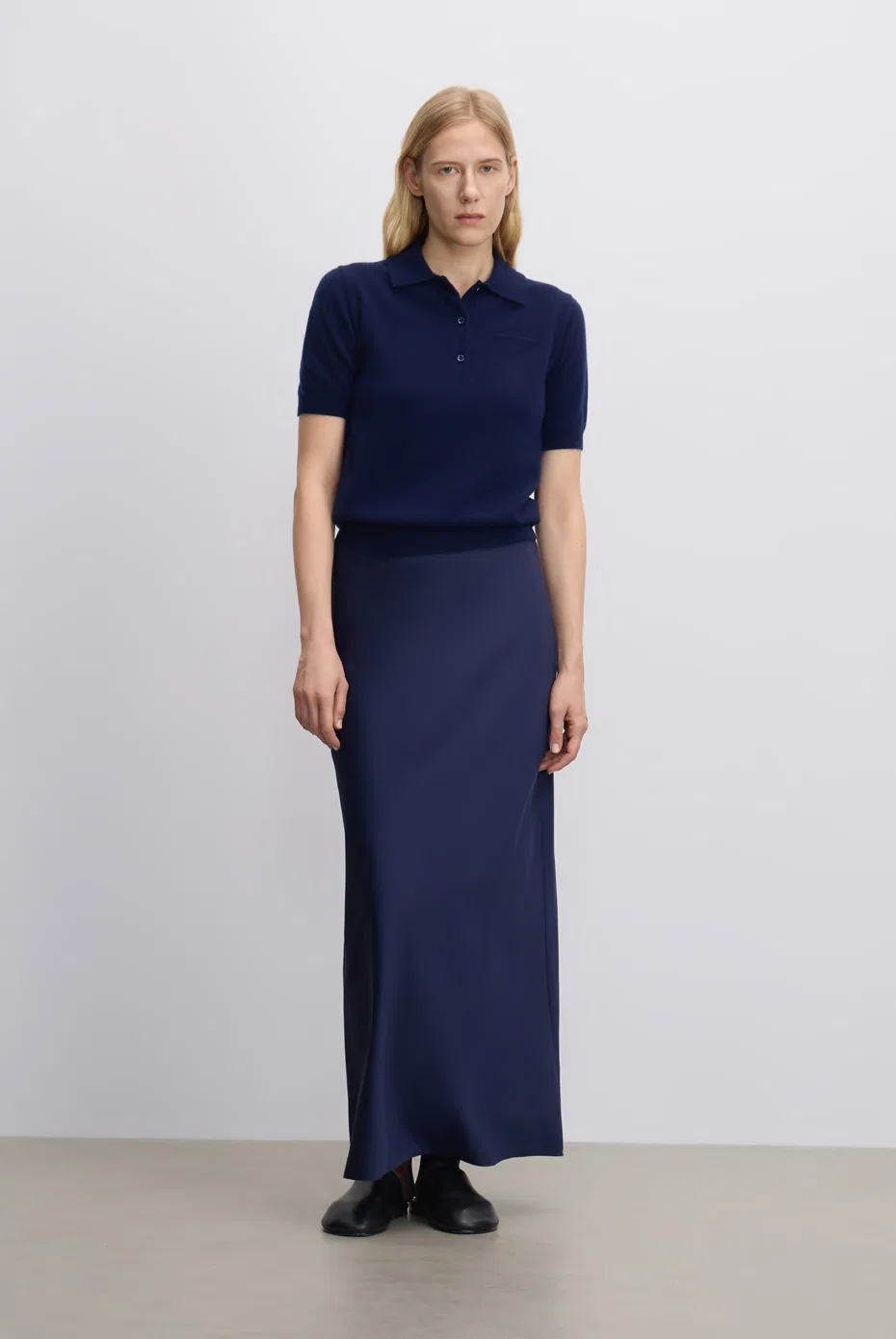 Navy short-sleeve knit with a matching floor-length skirt.