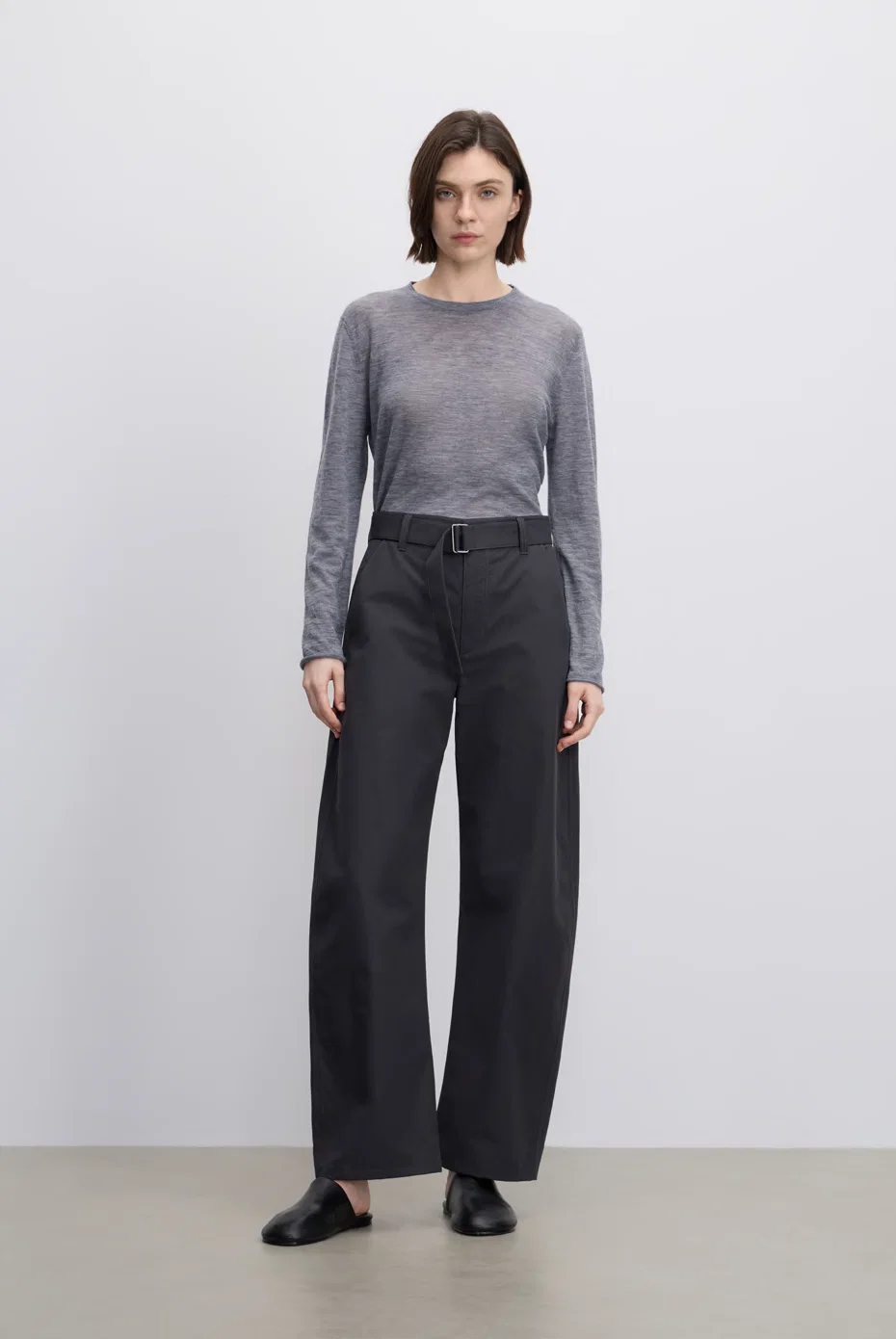 Grey knit top with charcoal wide-leg trousers.