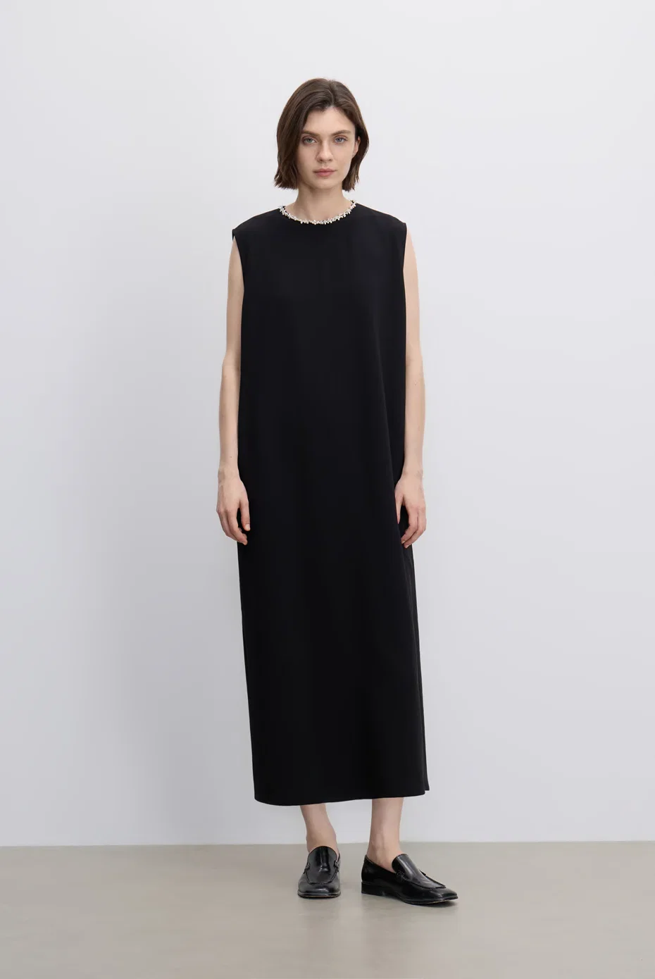 Sleeveless black column dress.